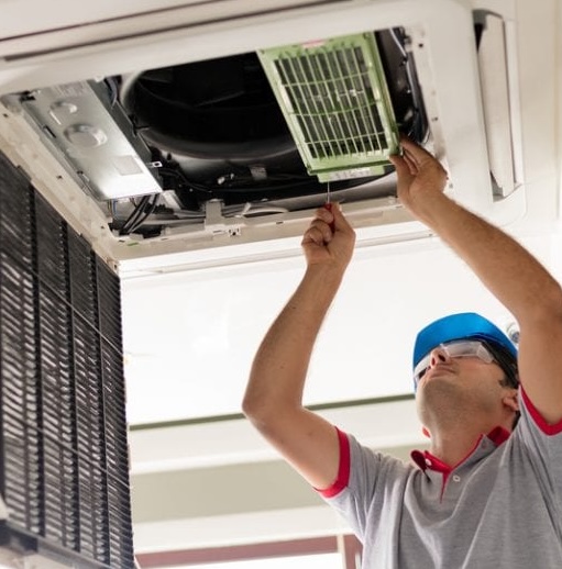 guy-fixing-ac-unit